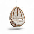 Hanging egg chair with cushion made of rattan and wood in cream color