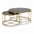 Gold metal nesting coffee tables with black glass tops set of two